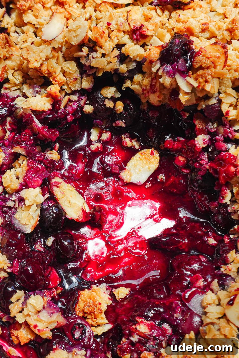 Guilt-Free Blueberry Crisp 7 A freshly baked healthy blueberry crisp cooling on a wire rack, with its bubbling fruit filling and perfectly golden, crunchy oat topping visible.