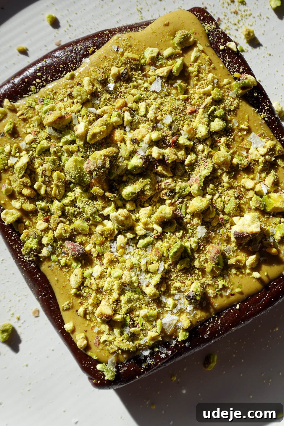 Effortless No Bake Pistachio Brownies Vegan Gluten-Free Small Batch 9 No bake pistachio brownies topped with pistachio butter and chopped pistachios