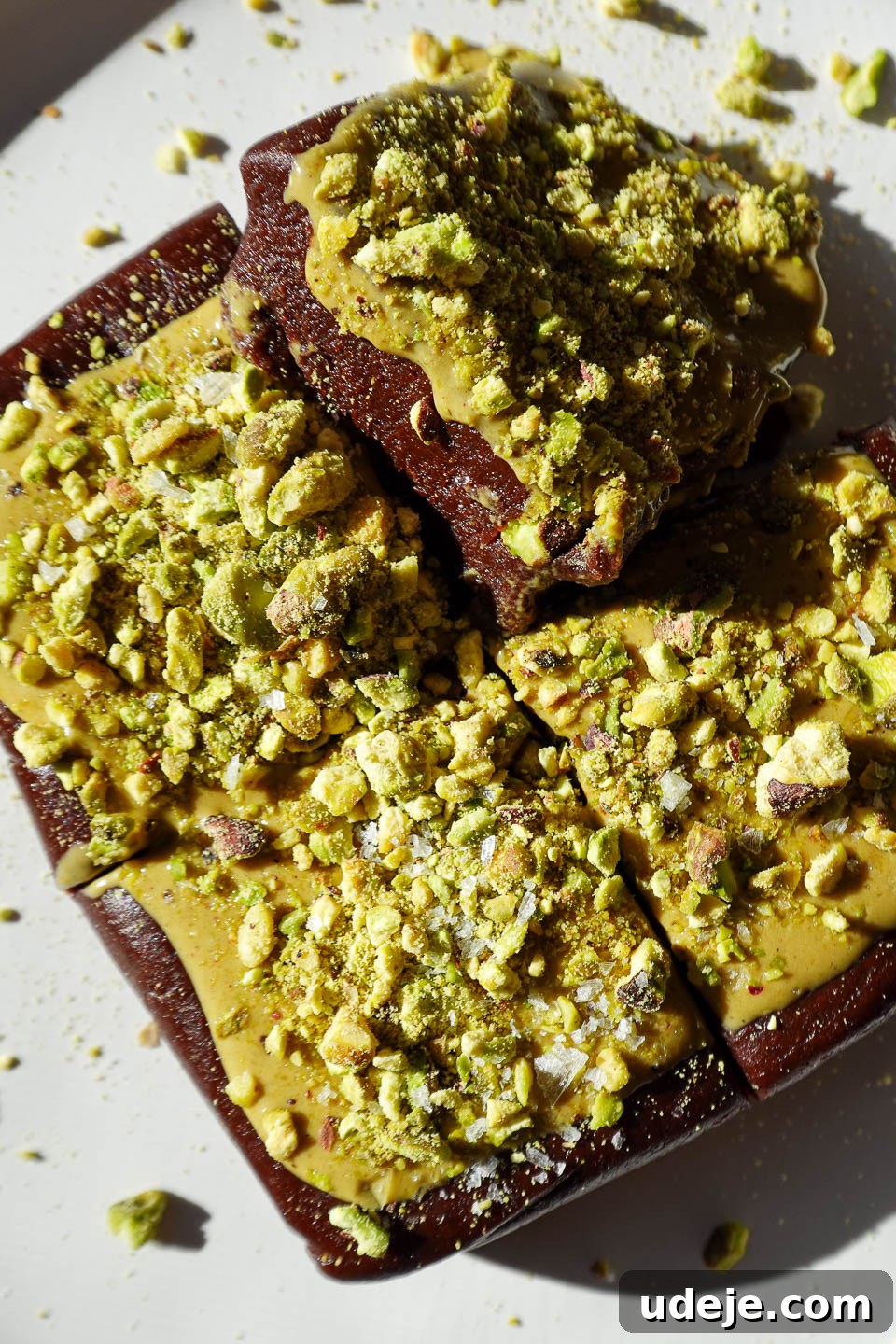 Effortless No Bake Pistachio Brownies Vegan Gluten-Free Small Batch 10 No bake pistachio brownies topped with pistachio butter and chopped pistachios