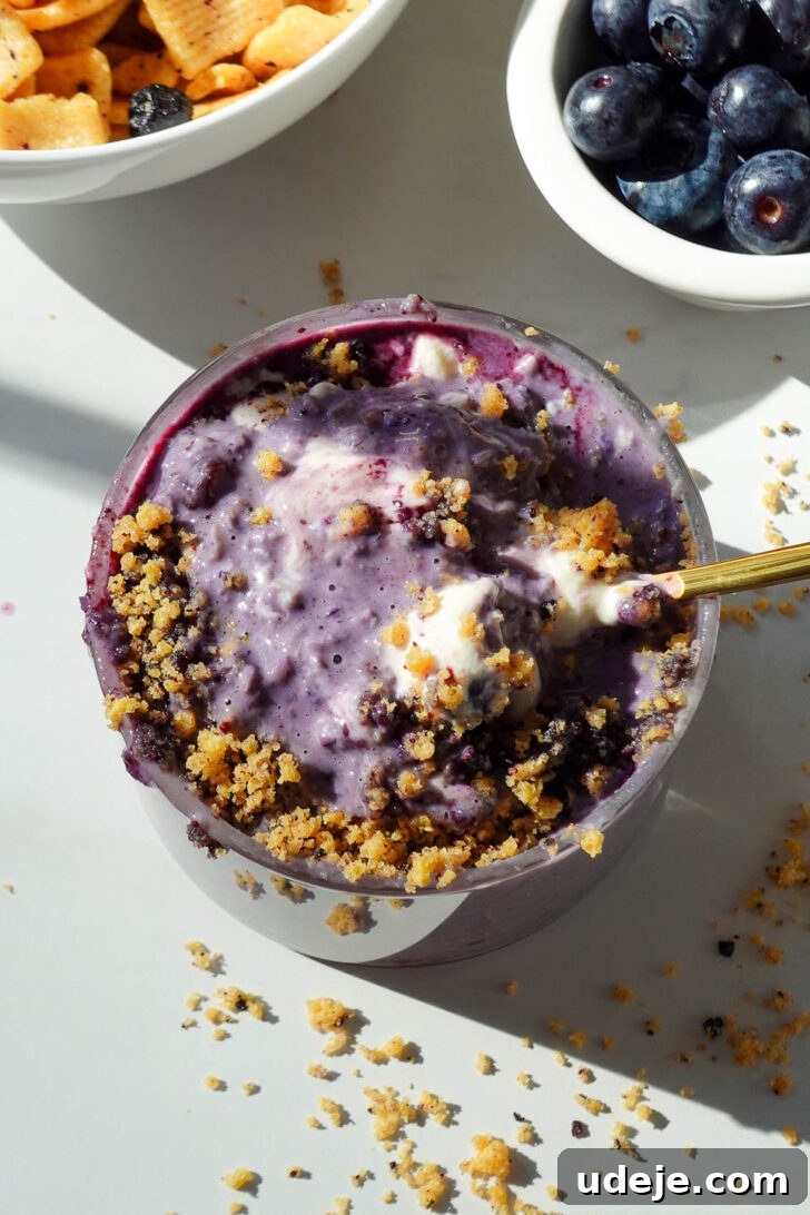 Blueberry Muffin Bliss Overnight Oats 6 close up of thick and creamy blueberry overnight oats with swirls of yogurt