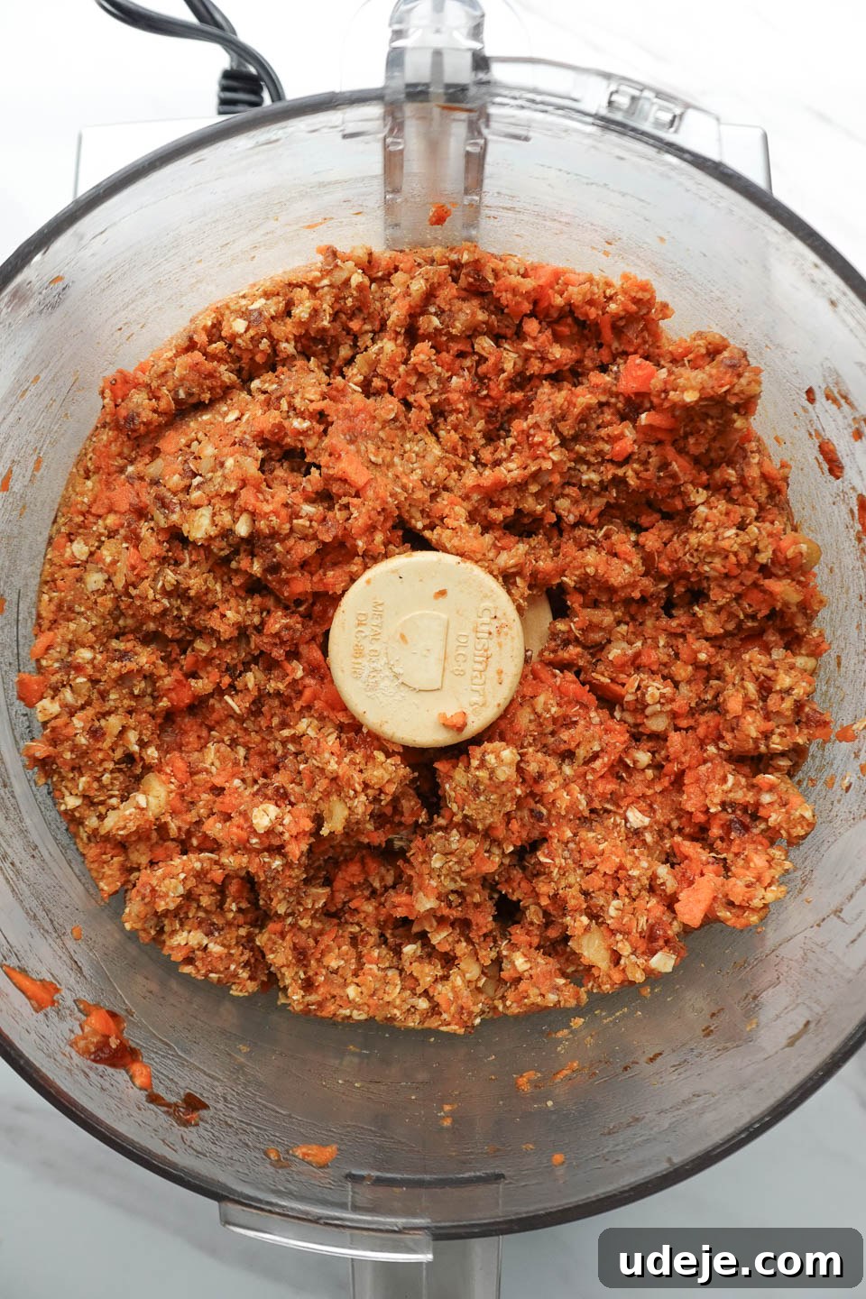 Dreamy No Bake Carrot Cake 11 no bake carrot cake mixture after being blended in food processor, ready to be pressed into pan