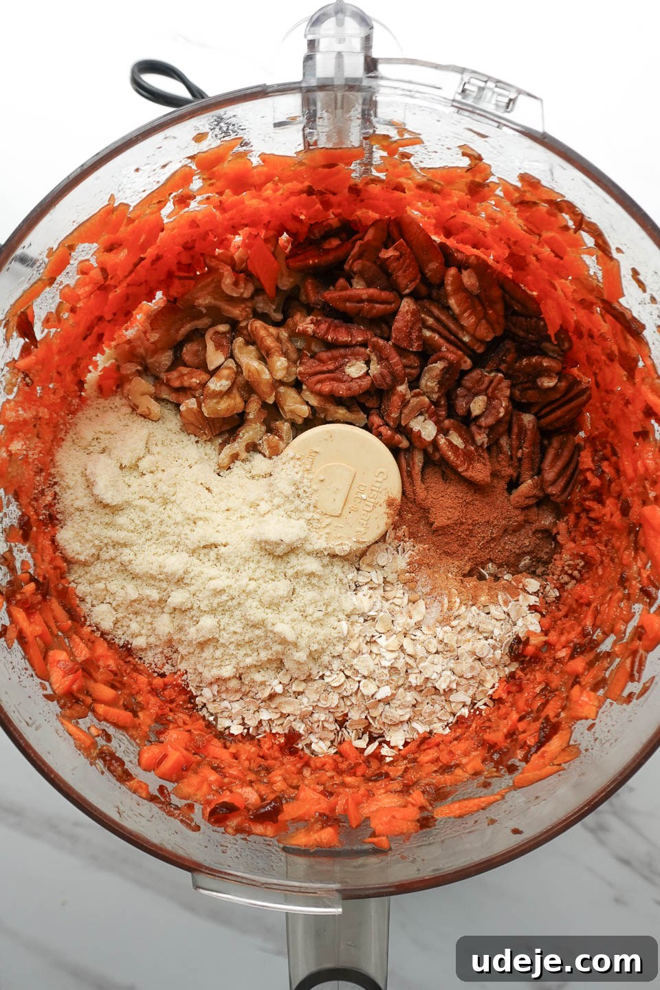 Dreamy No Bake Carrot Cake 10 Adding walnuts, oats, pecans, and almond flour to food processor