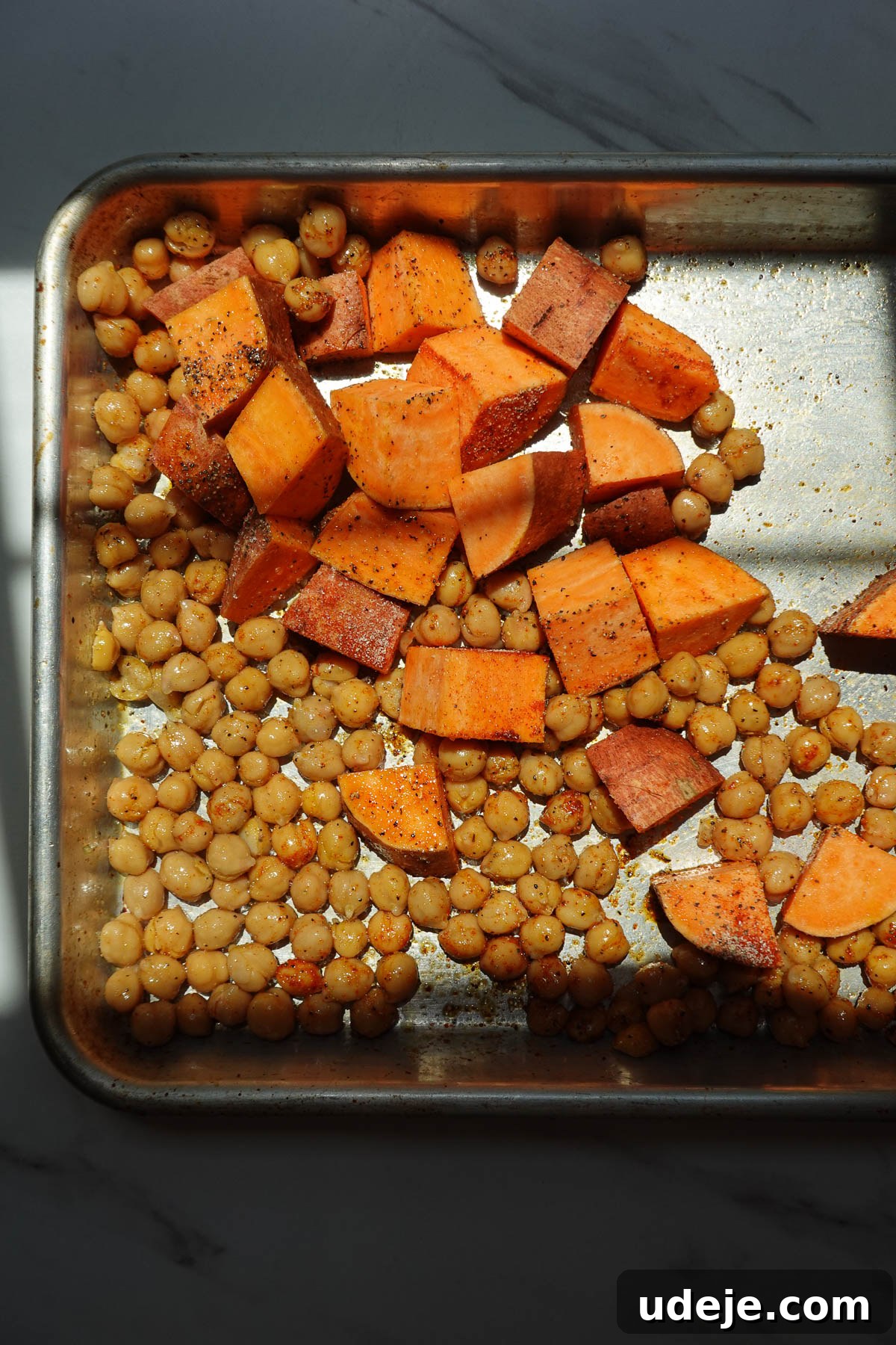 Roasted Sweet Potato & Chickpea Salad with Vegan Honey-Mustard Dressing 5 Roasting sweet potatoes and chickpeas on a baking sheet.