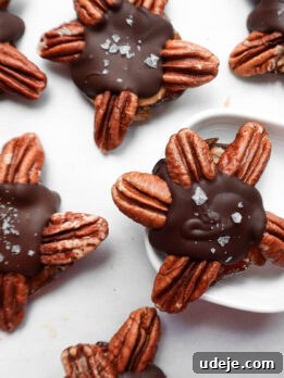 Finished healthy chocolate turtles made with just four ingredients arranged on a baking sheet