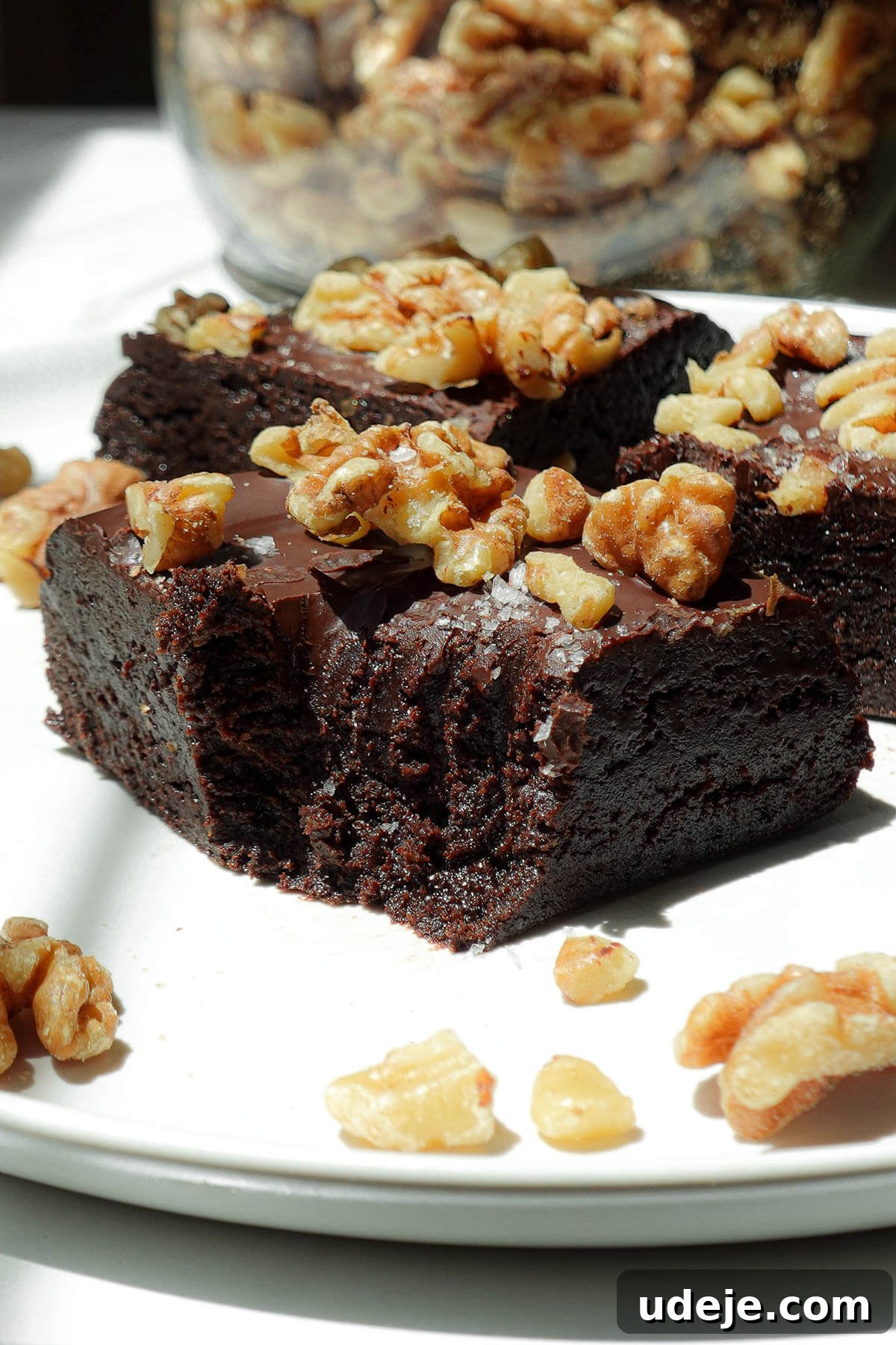 Fudgy Walnut Date Brownies Recipe 5 Close up of fudgy no-bake brownies made from walnuts and dates.