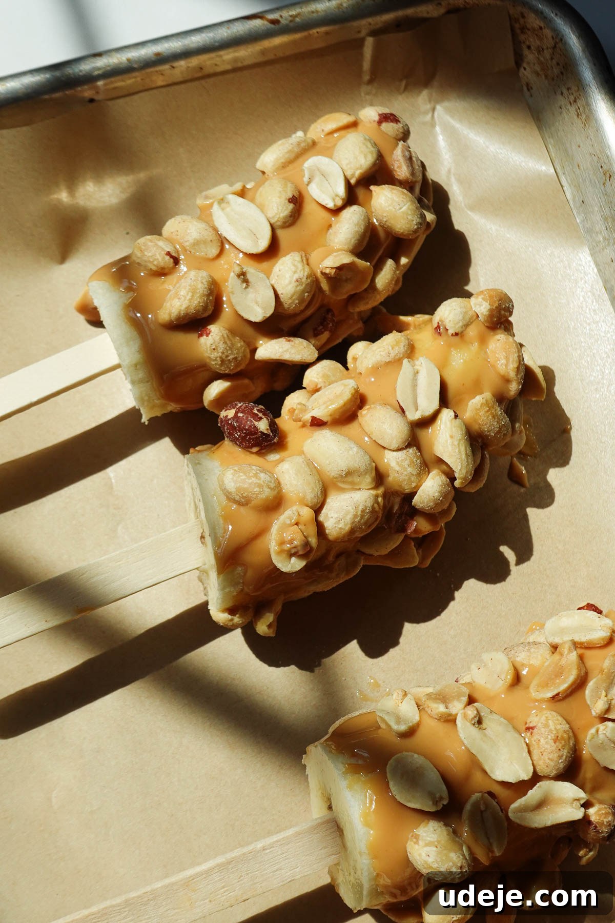 Snickers-Stuffed Frozen Banana Pops 9 Banana pops frozen before dipping