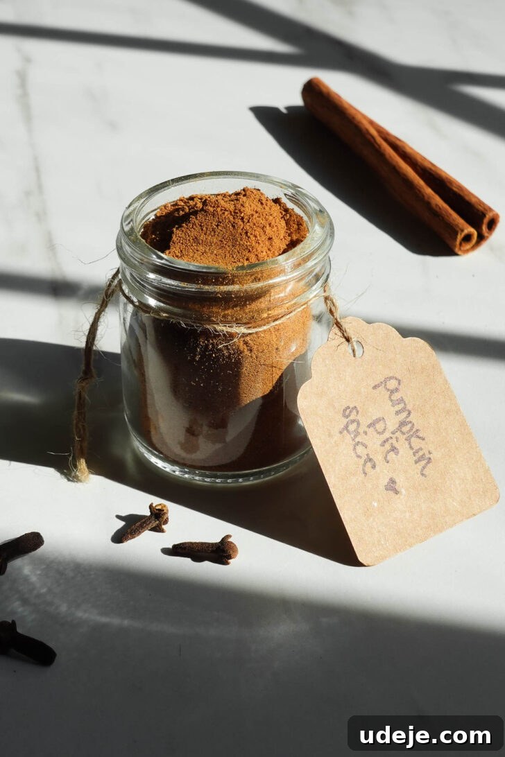 Homemade Pumpkin Pie Spice Blend Recipe 8 Homemade pumpkin pie spice in a small glass jar with a handwritten label.